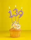 Number 139 candle - Birthday card design in yellow background Royalty Free Stock Photo