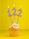 Birthday candle number 122 - Invitation card with yellow background