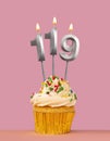 Number 119 candle with cupcake - Birthday card Royalty Free Stock Photo