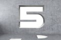 Number 5 is carved into a concrete wall Royalty Free Stock Photo