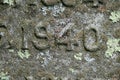Number carved in stone covered with lichen 1940 Royalty Free Stock Photo