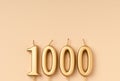 Number 1000 celebration festive background made with golden candles in the form of number Thousand