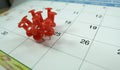 Number 25 day pinning on calendar with Red color pin thumbtack, concept for busy day Royalty Free Stock Photo