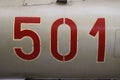 Number detail on MIG 21 aircraft. `501` numbers in Russian style