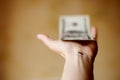 The number eight is applied on the wrist to attract money. Dollar bill in the hand. Numerology