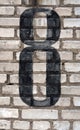 Number eight on brick wall. Royalty Free Stock Photo