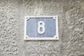 Number eight on the wall of a house Royalty Free Stock Photo