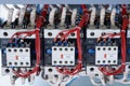 A number of electrical contactors with additional contacts installed on them