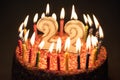 22 Number with festive candle for holiday cake. twenty two birth Royalty Free Stock Photo