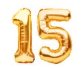 Number 15 fifteen made of golden inflatable balloons isolated on white. Helium balloons, gold foil numbers. Party decoration, Royalty Free Stock Photo