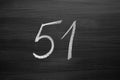 Number fifty one enumeration written with a chalk on the blackboard