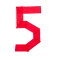 Number five made from red scotch tape on a white background Royalty Free Stock Photo