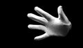 Number five 5 - a male hand wearing white glove isolated on black background. Open hand gestures Royalty Free Stock Photo