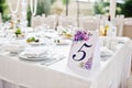 Number five at table for guests on wedding hall. Royalty Free Stock Photo