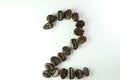 Number 2 form Coffee beans in white background Royalty Free Stock Photo