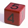 Number four and five written on a red wooden cube of a calendar date Royalty Free Stock Photo