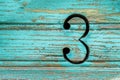 Number 3 on the green rustic boards Royalty Free Stock Photo