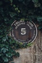 Number 5 heritage trail plaque on a wall of a building in Frome, UK Royalty Free Stock Photo