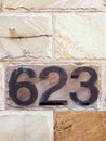 Number 623 House Number on Sandstone Wall Royalty Free Stock Photo