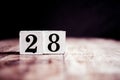 Number 28 isolated on dark background- 3D number twenty eight isolated on vintage wooden table