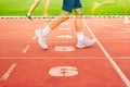 Number lanes track and athlete running on number lanes, Double exposure