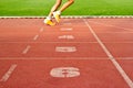 Number lanes track and athlete running on number lanes, soft focus Royalty Free Stock Photo