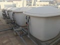 Number of 1000 liter capacity water tanks made of glass reinforced plastic kept over concrete bed with necessary Plumbing works