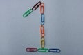 Number 1 made with colorful paper clips on white background Royalty Free Stock Photo