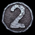 Number 2 made of forged metal in the center of coin isolated on black background. 3d