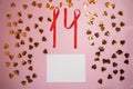 Number 14 made from red confetti ribbon on a pink background. Valentine`s Day