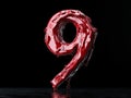 A number 9 made of red liquid on a black background Royalty Free Stock Photo