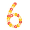 The number `6` made from sliced citrus fruits. Oranges, grapefruit. Isolated on white background