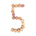 The number 5 is made from wine corks, close-up. Isolated on white background Royalty Free Stock Photo