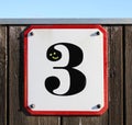 collage of number three metal sign on a wooden wall with a smiley under a blue sky Royalty Free Stock Photo