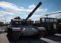 a number of military vehicles with a large tank on top