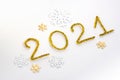 2021 number for New year greeting card. Christmas Party decoration on white background. Golden tinsel and snowflakes Royalty Free Stock Photo