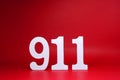 Number Nine One One  911  on Red Background with Copy Space - Police emergency call number Concept Royalty Free Stock Photo