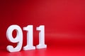 Number Nine One One  911  on Red Background with Copy Space - Police emergency call number Concept Royalty Free Stock Photo