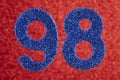 Number ninety-eight blue color over a red background. Anniversary.