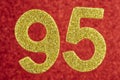 Number ninety-five golden color over a red background. Anniversary