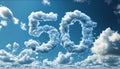 number 50 with object shaped clouds in the sky Royalty Free Stock Photo