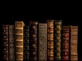 Number of old ancient books, library of knowledge textbooks. Black background isolate. AI generated. Royalty Free Stock Photo