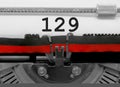 129 Number by the old typewriter on white paper Royalty Free Stock Photo