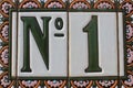 Number one 1 green white pink colorful design house number plate in Spain best winner first price win Royalty Free Stock Photo