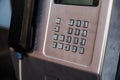 The number pad on a metal public pay phone. Royalty Free Stock Photo