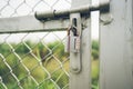 Number padlock on the iron door.soft focus