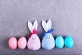 A number painted eggs, including two handmade Easter bunny, blue and pink