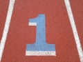 Number 1 painted on running track racing lane