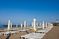 A number of plank beds and umbrellas on a beach Royalty Free Stock Photo