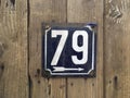 79 number plate on wood